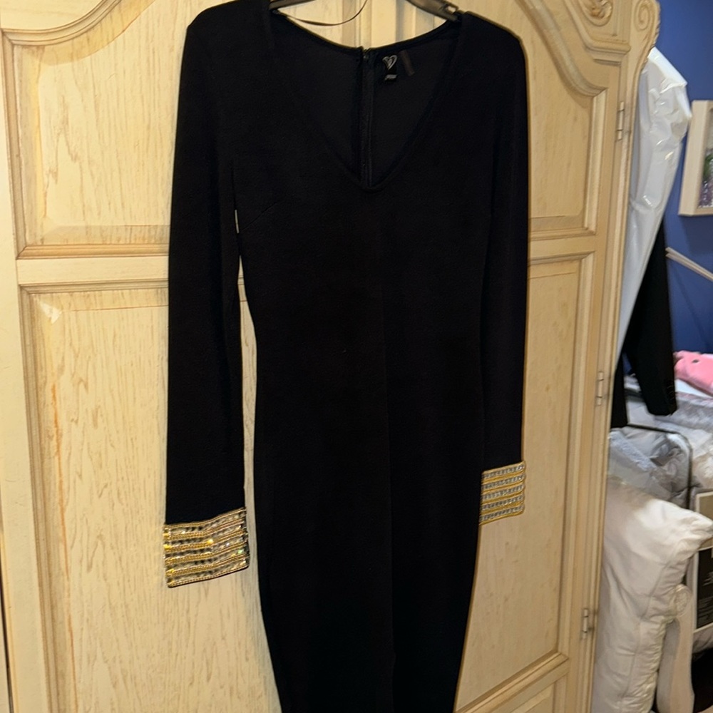 Black long sleeve gold accent dress